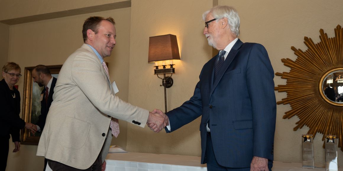 Griffin Rooker accepts award from Les Pitton