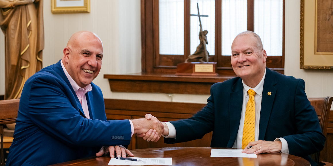 president joyce and rick weldon signing mou