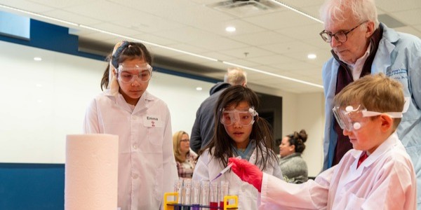 Dr. Miles working with students on STEM Day.